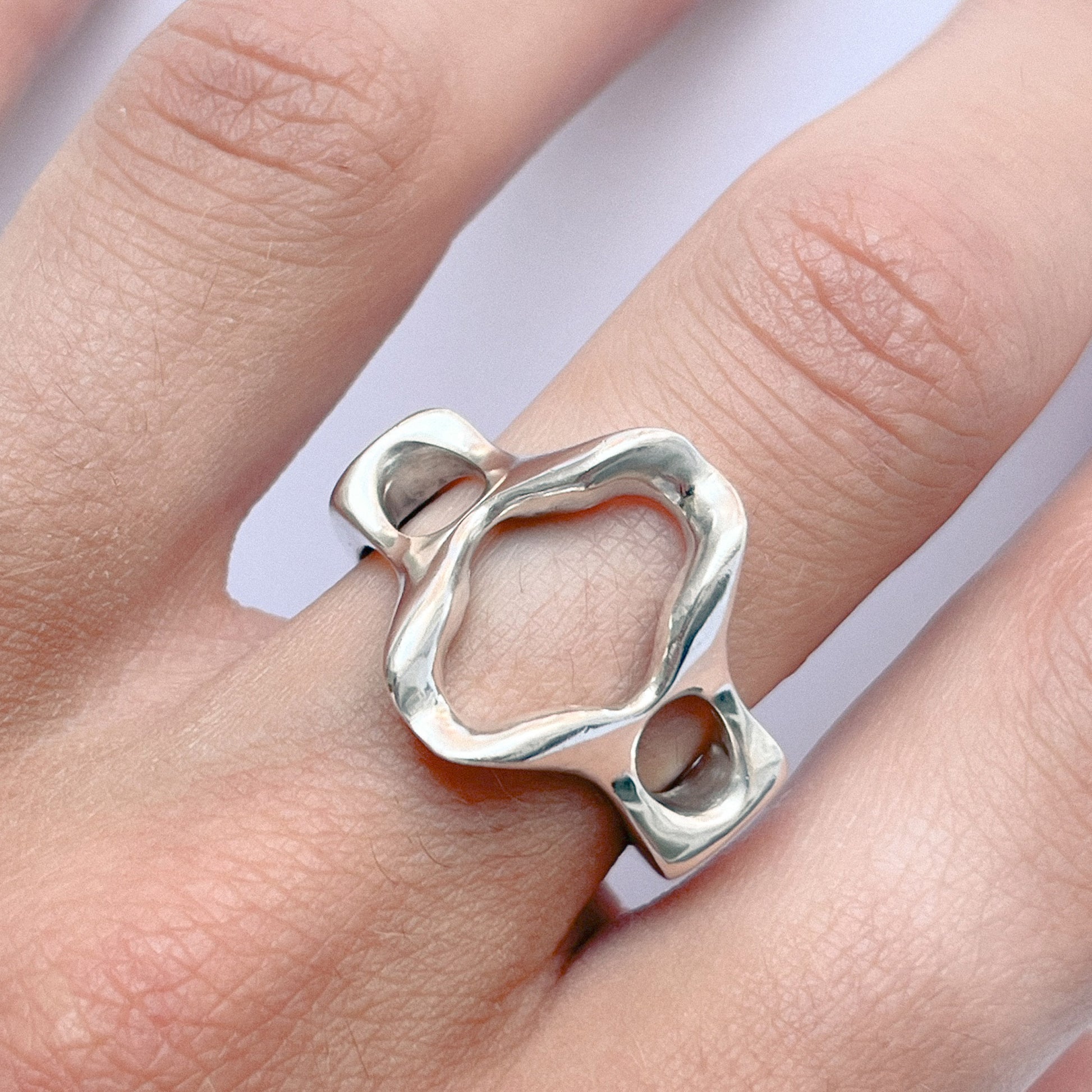 Beso Ring handmade in 925 Sterling Silver worn on finger by BÚMBUNER
