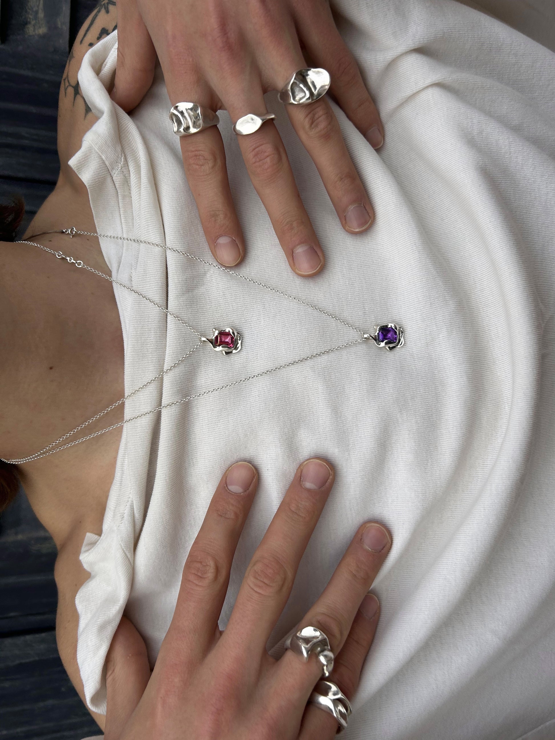 Chloe Necklace handmade in 925 Sterling Silver with natural Pink Topaz and Amethyst worn with rings by BÚMBUNER
